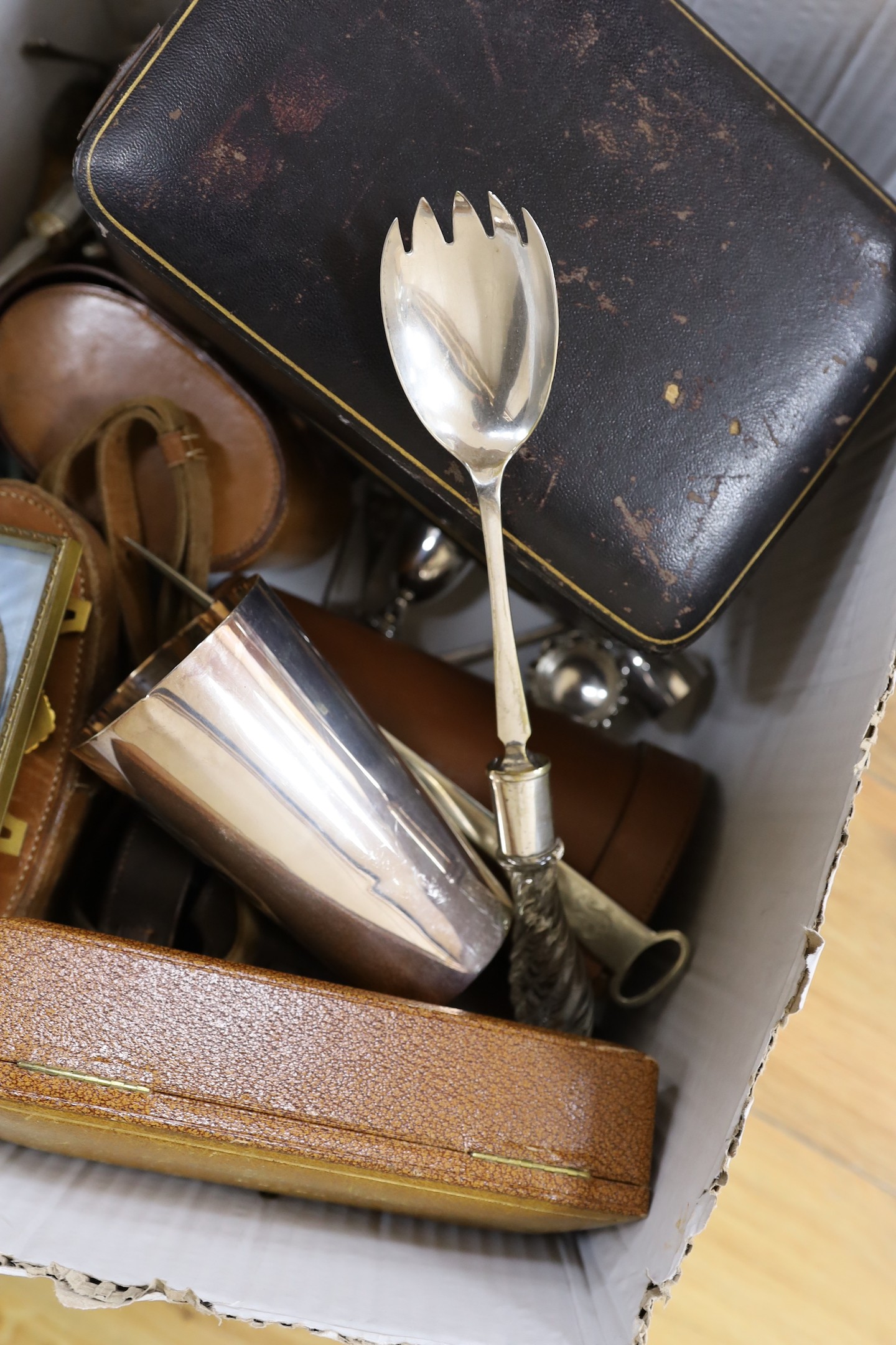 A George V silver capstan inkwell and a cased silver hair brush, two leather cased plate mounted glass flasks and tumbler sets, a George V cased silver christening bowl and mug set, a leather cased pair of silver hair br